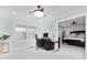 Bright office with plantation shutters, desk, seamless tile, and access to the main bedroom at 4202 Deepwater Ln, Tampa, FL 33615