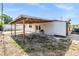 Expansive backyard featuring a covered patio, offering an inviting outdoor space for relaxation and entertainment at 4527 W Minnehaha St, Tampa, FL 33614