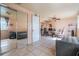 Bedroom with mirrored closet doors, tiled floors, and furniture, blending storage with modern living at 4527 W Minnehaha St, Tampa, FL 33614