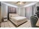 Comfortable bedroom showcasing neutral tones, a ceiling fan, and a private workspace at 4527 W Minnehaha St, Tampa, FL 33614