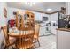 Kitchen area, showing appliances next to dining area and wooden table with chairs at 4527 W Minnehaha St, Tampa, FL 33614