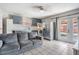 Living space featuring updated gray cabinets, modern appliances, and seamless access to the outdoors at 4527 W Minnehaha St, Tampa, FL 33614