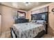 Main bedroom with large bed, dresser, and window, creating a cozy and comfortable retreat at 4527 W Minnehaha St, Tampa, FL 33614