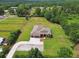 Expansive property featuring a well-maintained home, lush green lawn, and equestrian features at 4608 Scott Rd, Lutz, FL 33558