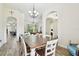 Spacious dining room with wooden table and seating, open to the living areas at 4608 Scott Rd, Lutz, FL 33558