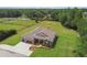 Aerial view of house showcasing surrounding acreage at 4608 Scott Rd, Lutz, FL 33558