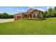 Beautiful home with a lush green lawn and mature landscaping at 4608 Scott Rd, Lutz, FL 33558