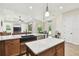 Kitchen island with granite countertops and a black farmhouse sink at 4608 Scott Rd, Lutz, FL 33558