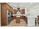 Kitchen with custom cabinets, stainless steel appliances and a center island at 4608 Scott Rd, Lutz, FL 33558