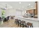 Modern kitchen with stainless steel appliances, granite countertops, and a large island at 4608 Scott Rd, Lutz, FL 33558