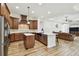 Modern kitchen with granite countertops, dark wood cabinetry, and a center island at 4608 Scott Rd, Lutz, FL 33558