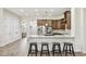 Gourmet kitchen with granite countertops, dark wood cabinetry, and stainless steel appliances at 4608 Scott Rd, Lutz, FL 33558