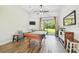 Game room features a billiards table, tile flooring, and bright natural light at 4608 Scott Rd, Lutz, FL 33558