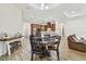 Open living space with a leather sofa, dining area, and lots of natural light at 4608 Scott Rd, Lutz, FL 33558