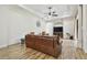 Spacious living room showcasing wood-look flooring and neutral wall color at 4608 Scott Rd, Lutz, FL 33558