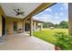 Covered patio overlooking large backyard at 4608 Scott Rd, Lutz, FL 33558