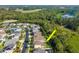 Aerial view of suburban neighborhood showcasing home's location near green spaces at 5446 Suncatcher Dr, Wesley Chapel, FL 33545