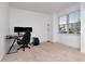 Bedroom with large window, neutral carpet and lots of natural light at 5446 Suncatcher Dr, Wesley Chapel, FL 33545