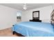 Bright bedroom with a ceiling fan and a large window offering ample natural light at 5446 Suncatcher Dr, Wesley Chapel, FL 33545