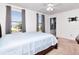 Bright bedroom with large windows and a ceiling fan at 5446 Suncatcher Dr, Wesley Chapel, FL 33545