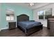 Main bedroom featuring ample natural light, wood floors, and a neutral color scheme at 5446 Suncatcher Dr, Wesley Chapel, FL 33545
