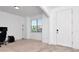 Bright office with neutral carpet, window views, and a convenient doorway for easy access at 5446 Suncatcher Dr, Wesley Chapel, FL 33545