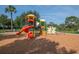 Colorful playground with slides, climbing structures, and soft ground covering for safe play at 5446 Suncatcher Dr, Wesley Chapel, FL 33545