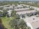 Aerial view of townhouse community with garages and landscaped grounds at 580 Shoreham Ne Ct, St Petersburg, FL 33716