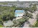 Community featuring tennis courts, a pool and lush tropical greenery at 580 Shoreham Ne Ct, St Petersburg, FL 33716