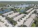 Peaceful waterfront community with stylish townhomes, showcasing an idyllic lakeside living experience at 580 Shoreham Ne Ct, St Petersburg, FL 33716