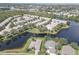 Aerial view of waterfront homes, highlighting the tranquil lake setting and desirable neighborhood amenities at 580 Shoreham Ne Ct, St Petersburg, FL 33716