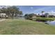 Expansive backyard offering serene water views and lush greenery at 580 Shoreham Ne Ct, St Petersburg, FL 33716