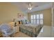 Comfortable bedroom with bright windows, ceiling fan, and serene decor at 580 Shoreham Ne Ct, St Petersburg, FL 33716