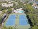 Aerial view of community tennis courts and pool at 580 Shoreham Ne Ct, St Petersburg, FL 33716