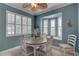 Dining room with a bay window, a ceiling fan, and stylish decor at 580 Shoreham Ne Ct, St Petersburg, FL 33716