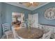 Charming dining room with views into the adjacent living room at 580 Shoreham Ne Ct, St Petersburg, FL 33716