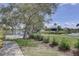 Scenic lakeside community featuring lush greenery and well-maintained landscaping at 580 Shoreham Ne Ct, St Petersburg, FL 33716