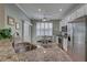 Bright kitchen with granite countertops, stainless steel appliances, and a dining area at 580 Shoreham Ne Ct, St Petersburg, FL 33716