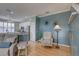 Comfortable seating in the living room painted with an accent wall at 580 Shoreham Ne Ct, St Petersburg, FL 33716