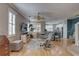 Open concept living room with comfortable seating and view of the kitchen at 580 Shoreham Ne Ct, St Petersburg, FL 33716