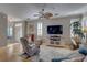 Relaxing living room features a ceiling fan, comfortable seating and lots of natural light at 580 Shoreham Ne Ct, St Petersburg, FL 33716