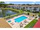 Aerial view of condos with a pool, hot tub and lake view at 5817 Park N St # 310, St Petersburg, FL 33709