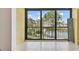 Tiled balcony showcases a scenic view of the lake and landscaped grounds at 5817 Park N St # 310, St Petersburg, FL 33709