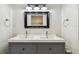 Modern bathroom featuring double vanity with stylish mirror and lighting at 5817 Park N St # 310, St Petersburg, FL 33709