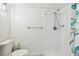 Bathroom features a toilet and a bright, white shower at 5817 Park N St # 310, St Petersburg, FL 33709