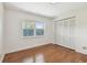 Bedroom featuring hardwood floors, a window, and closet at 5817 Park N St # 310, St Petersburg, FL 33709