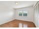 Bright bedroom with hardwood floors, closet, and natural light at 5817 Park N St # 310, St Petersburg, FL 33709