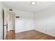 Bedroom with hardwood floors, closet, and a ceiling light at 5817 Park N St # 310, St Petersburg, FL 33709