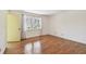 Bright bedroom featuring wood floors and a window at 5817 Park N St # 310, St Petersburg, FL 33709