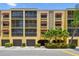 Well maintained condominium building with covered parking and lush tropical plants at 5817 Park N St # 310, St Petersburg, FL 33709